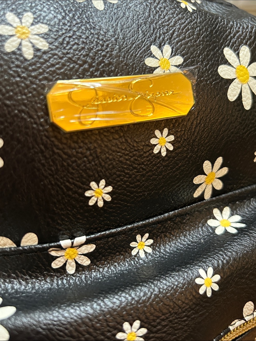 Jessica Simpson Black Daisy Mini Backpack with Gold Hardware and 2 Charms.
NWT - Picture 4 of 4